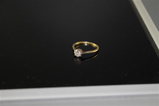 An 18ct and Pt. solitaire diamond ring, size R, gross weight 2.2 grams,